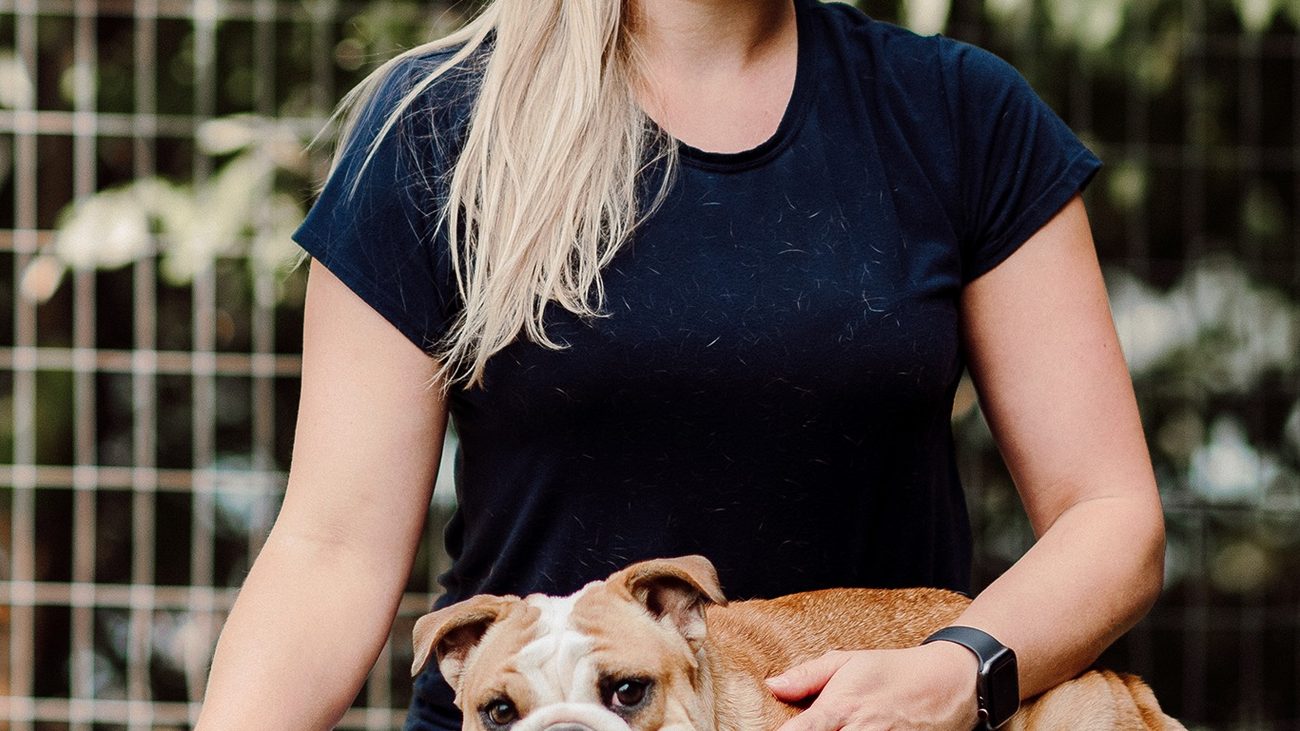 A certified trainer working with dogs
